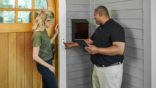 Woman having her First Alert video doorbell installed